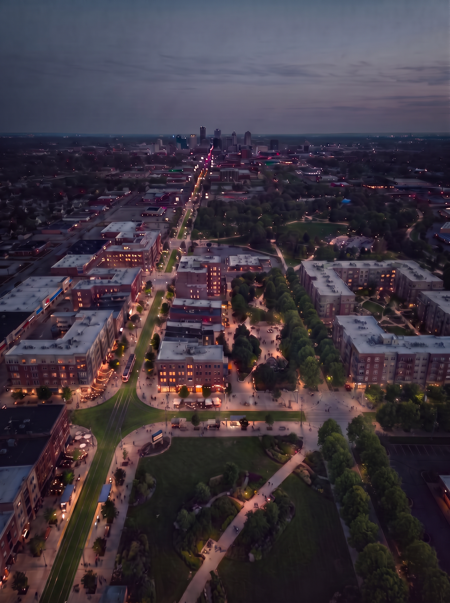 The same city reimagined car-free: dense housing and narrow walking streets around a light-rail line